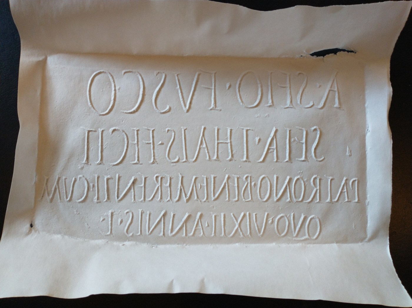 Squeeze (paper reproduction) of a Latin inscription